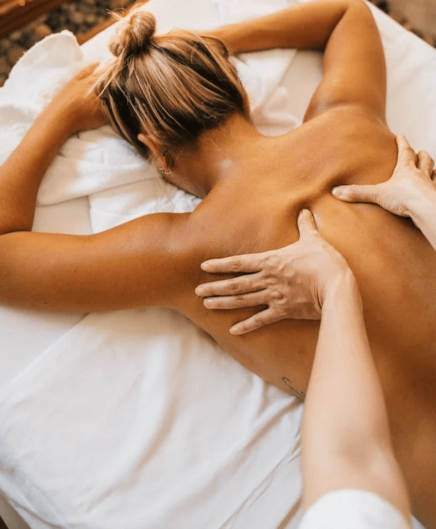 Patient receives massage therapy for back pain